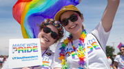 Parade: UTSW students Avery Hager (left) and Miranda Hairgrove pose for a colorful photo.