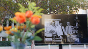 A photo of UTSW Nobel Laureates (from left) Johann Deisenhofer, Ph.D., Dr. Brown, and Dr. Goldstein taken in 2010 decorated the plaza for the outdoor reception.