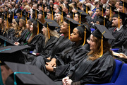 Graduates watch the ceremony.