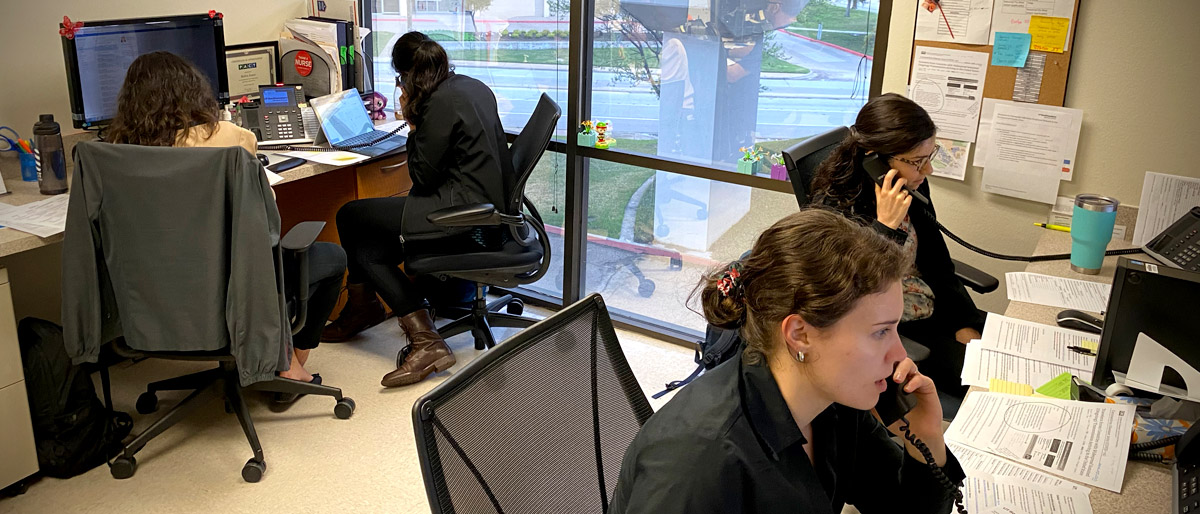 Group of students answering phones