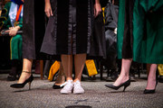 Dr. Emily Frisby wears the same sneakers as she did when she graduated from high school.
