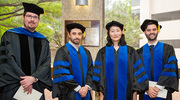 From left, Jacques Lux, Ph.D., Associate Professor of Radiology, Sina Khorsandi, Ph.D., Xiao Liang, M.S., Ph.D., and Jace Grandinetti, M.S., Ph.D., wait for the ceremony to begin.
