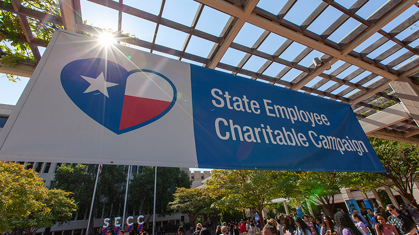 Banner with heart around Texas Flag that says State Employee Charitable Campaign