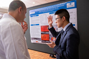 Dr. Shai Rozen meets with medical student William Ou whose research studied age-related macular degeneration.