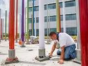 Poles were bolted to the floor, then the bases covered in gravel.