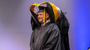 Marcus Anthony Hurt, M.S., receives his hood.