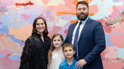 Program Development Award winner Dr. Nelson with his family. From left: Jessica Nelson (a Physician Assistant in Urology at UTSW), Eva, and Drew.
