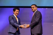 Dr. Dharam Kumbhani is all smiles while accepting his Rising Star Award from Dr. Lee.