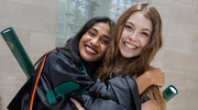 Koshma Eswaramoorthy, M.D., left, and Courtney Roberts, M.D., share a congratulatory hug after the ceremony.
