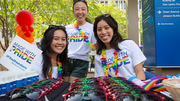 Brunch: Visitor Quynh-Thy Dang (left) helps hand out festive swag with UTSW students Angela Wang (center) and Chi Dang at the brunch.