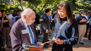 Dr. Joseph L. Goldstein, M.D., shares insights about his research with an attendee.