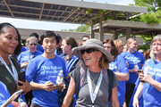 Employees clad in blue 75th anniversary t-shirts