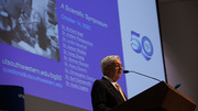 Michael S. Brown, M.D., speaks near the end of the scientific symposium that honored the 50-year partnership he has shared with Joseph L. Goldstein, M.D.
