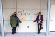 That mask does indeed make you beautiful! Pictured from left: Suzi Smith, Director of Student Services, and Carol Wortham of Student Academic Support Services.
