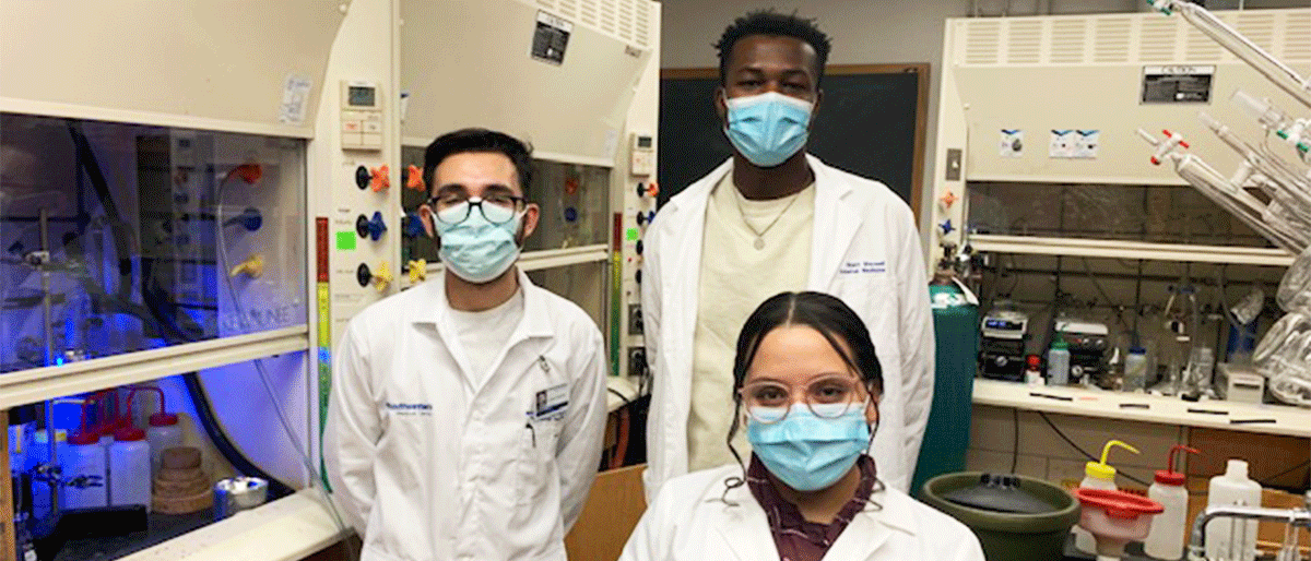 three postbac students in lab