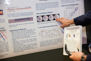 Medical student Feng Gao explains his research project that developed an optical probe to monitor spinal cord blood flow and oxygenation in real-time at multiple sites along the spine.