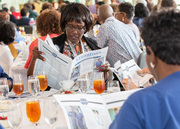 Honorees take a peek at the employee recognition edition of Center Times.