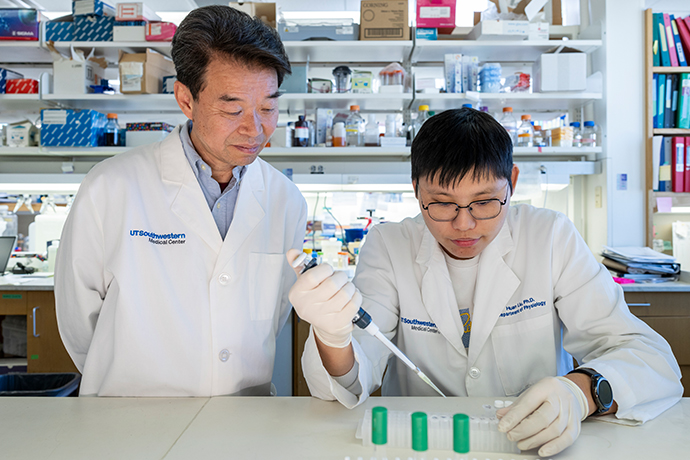Two scientists working with samples in a lab.