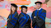 Displaying proud graduate attitude (from left) are Yuqing Zhang, Junqiu Zhang, and Junjie Ma.