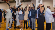 Erica Ogwumike is surrounded by her loved ones as she celebrates her match.