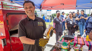 Aw, shucks. The vendor from Stewart's Roasted Corn is all smiles serving food to the UTSW community.