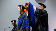 Biomedical Engineering graduate Kara Acevedo, Ph.D., is hooded by W. Matthew Petroll, Ph.D., Professor of Ophthalmology and Biomedical Engineering.