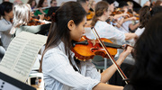 Ms. Wang, who plays the violin, also joined the orchestra.