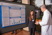 Medical student Neha Mulpuri discusses her research project about adolescent weight loss surgery with Dr. Shai Rozen.