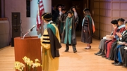Devin Shah, M.D., cheers as he walks across the stage!