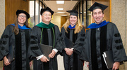 Faculty members (from left) Anne Satterthwaite, Ph.D., Associate Professor of Internal Medicine and Immunology; Christoph Lehmann, M.D., Professor of Pediatrics and in the Lyda Hill Department of Bioinformatics, Medical School Dean’s Office, and the Peter O’Donnell Jr. School of Public Health; Ondine Cleaver, Ph.D., Professor of Molecular Biology; and Richard Robinson, Ph.D., Professor of Psychiatry; prepare to support the graduates as they walk across the stage.