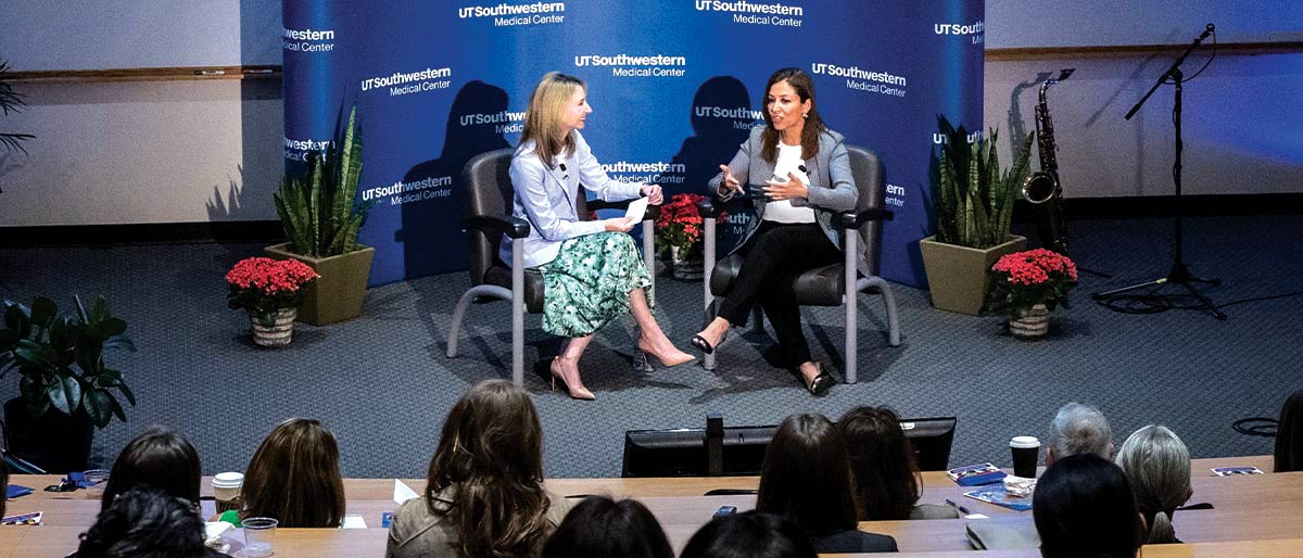 two women on stage talking