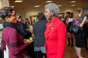 Dr. Hannah Valantine chats with an employee at the program’s reception.