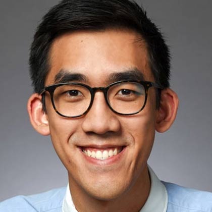 Man with glasses and collared shirt