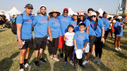 A group of walkers poses for a photo near the UT Southwestern staging area.