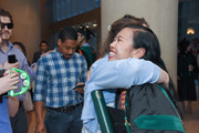 Medical student hugging a friend after commencement.