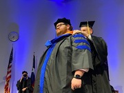 Dr. Sherwood Brown, Professor of Psychiatry, hoods Dr. Joshua Becker, who received his doctorate in clinical psychology.