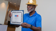 Leonard Graves, Gold pin recipient, is all smiles after receiving his certificate.