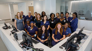 The infusion treatment team's registered nurses and certified medical office assistants pose for a group photo.