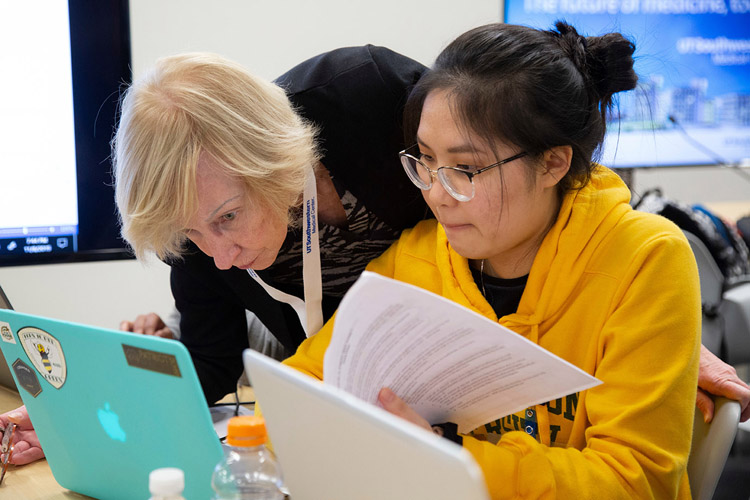 Two women looking at a computer screen