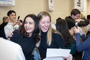 Ruby Pandey (left) and Whitney Stuard hug after learning their matches.