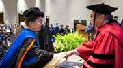 Han Wu, Ph.D., receives her degree from Dr. Podolsky.