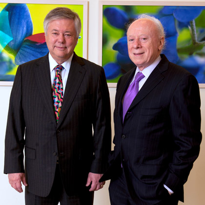 Two men in suits side-by-side
