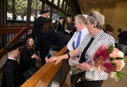 Attendees Ted and Marge Leigh watch graduates arrive for the ceremony.