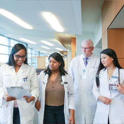 Group of people in white lab coats
