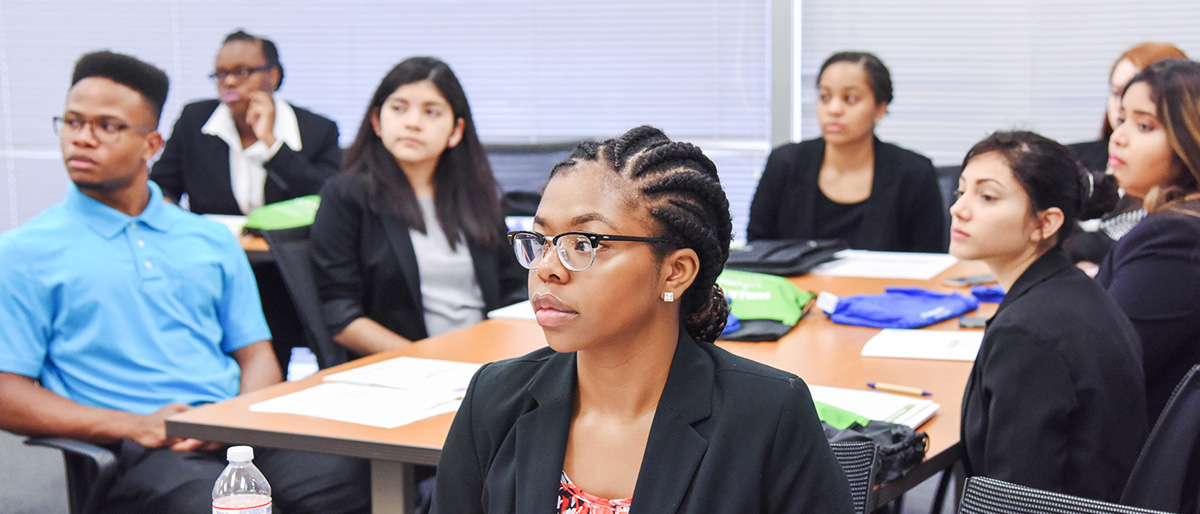 Student interns seated at table