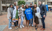 Cayenne Price, posing for a photo with her family and Shawna Nesbitt, M.D., holds up her Match Day T-shirt.