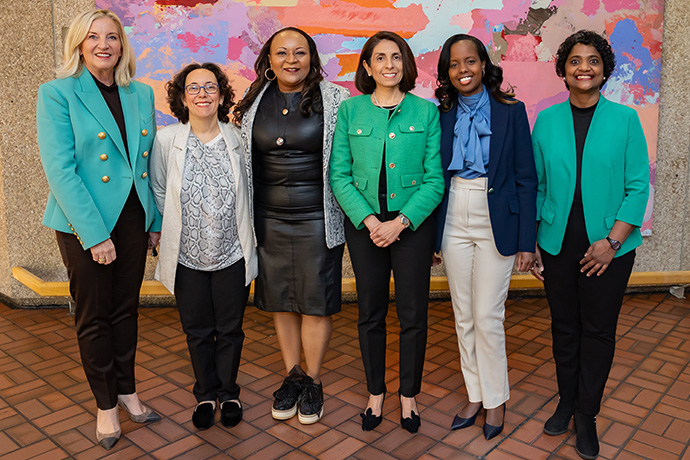 group of 6 professional women standing side by side