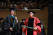 Dr. Blake Barker and UT Southwestern President Dr. Daniel K. Podolsky presenting diplomas during commencement.