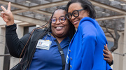 Event keynote speaker Cynthia “Cynt” Marshall, CEO of the Dallas Mavericks (right), shares a joyful pose with RN D’Amber Howell, B.S.N., during the reception for UT Southwestern’s annual Martin Luther King Jr. Commemorative Celebration in January. Ms. Marshall challenged the audience to be courageous in responding to obstacles they may face, just as Dr. King did to fight racial injustice.