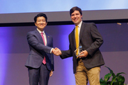Dr. W. P. Andrew Lee, Executive Vice President for Academic Affairs, Provost, and Dean of UT Southwestern Medical School, and Dr. James “Brad” Cutrell after being presented with a Rising Star Award.
